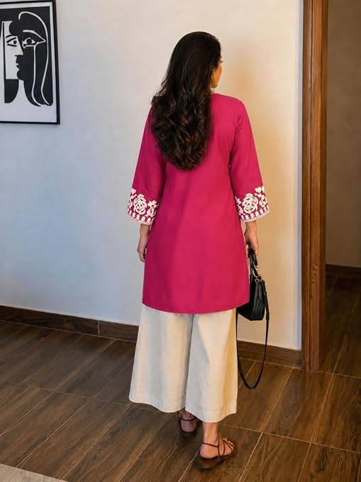 Back view of ANNI DESIGNER pink kurta with embroidered cuffs and cream palazzos