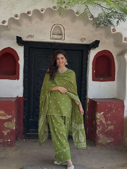 Olive green kurta set with printed dupatta draped across both shoulders