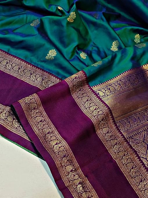 Close-up of purple saree border with intricate gold-coloured detailing