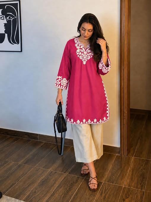 Pink embroidered kurta and cream palazzos styled with black sandals