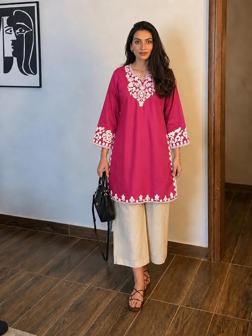 Front view of pink kurta palazzo set with cream floral embroidery
