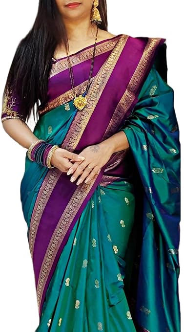 Model wearing a teal green saree with a purple and gold-coloured border++hrl. sy679 