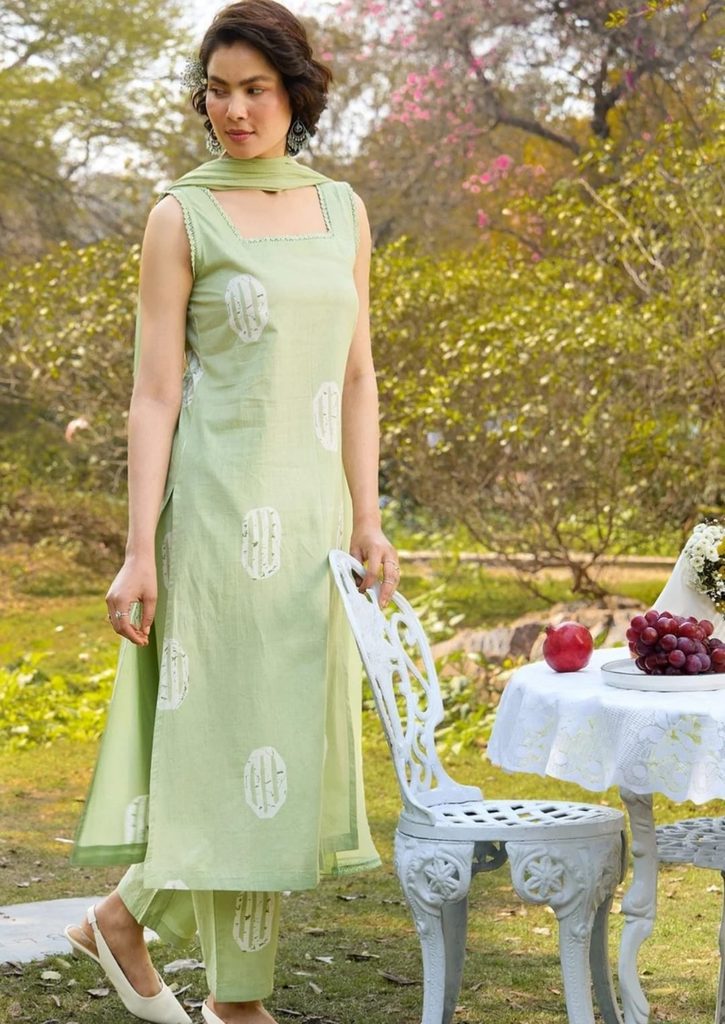 White printed motifs on light green kurta and matching trousers