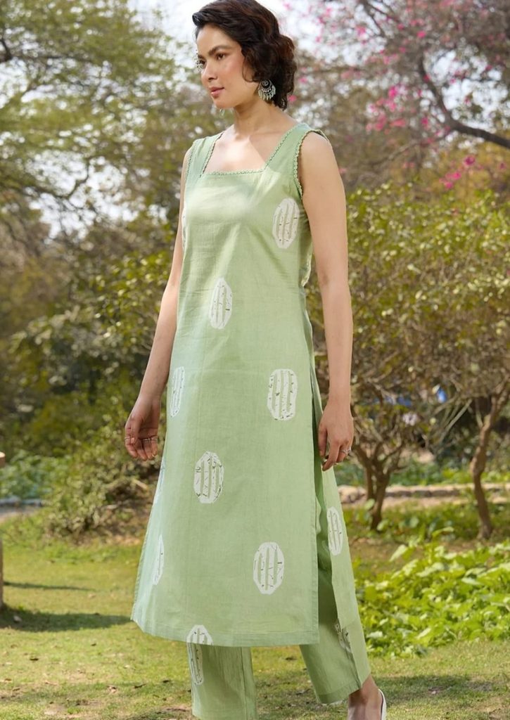 White printed motifs on light green kurta and matching trousers