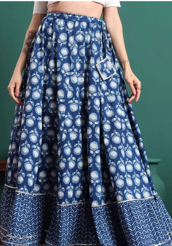 Front view of blue floral printed maxi skirt with contrasting patterned hem