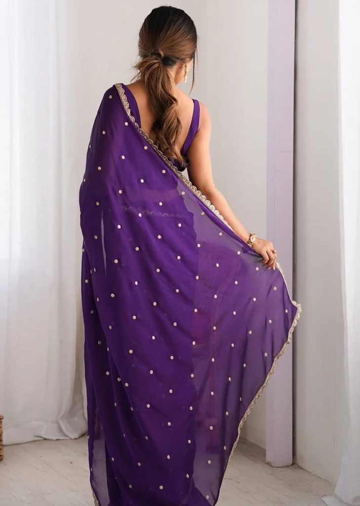 Back view of purple georgette saree showing embellished pallu