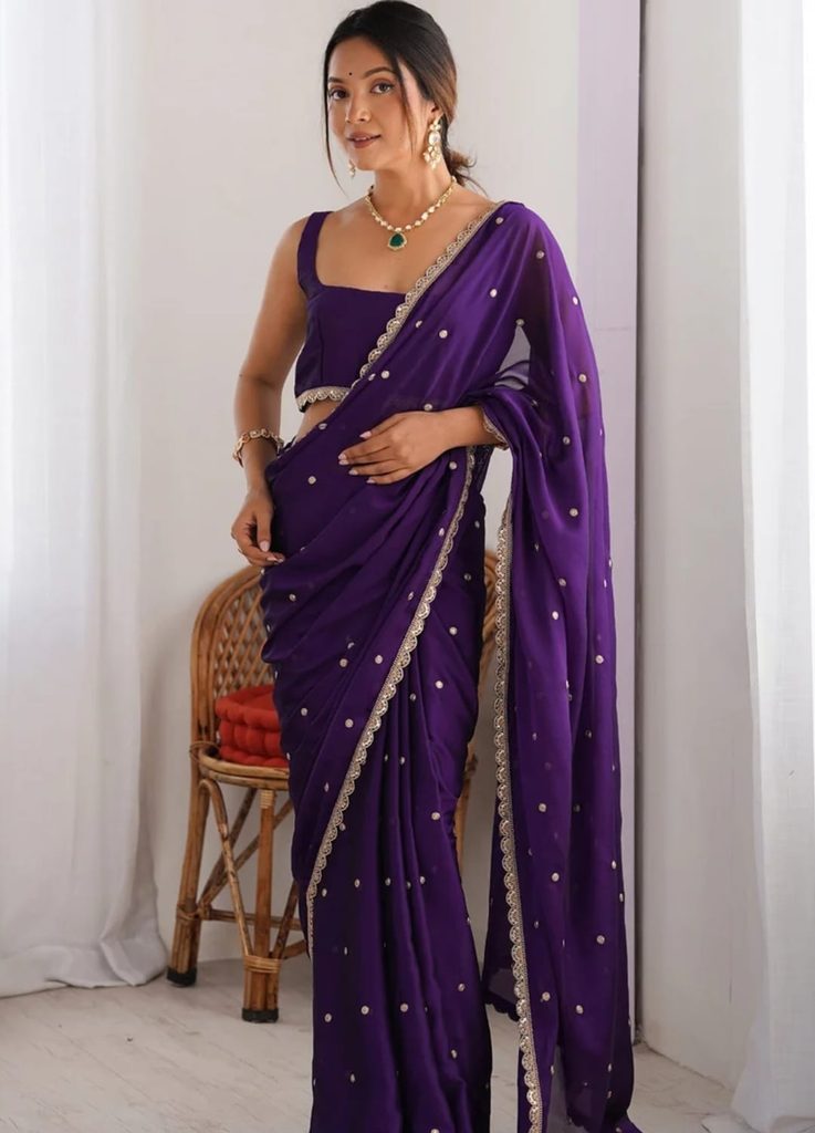 Saree Mall purple sequinned georgette saree with gold-tone scalloped border