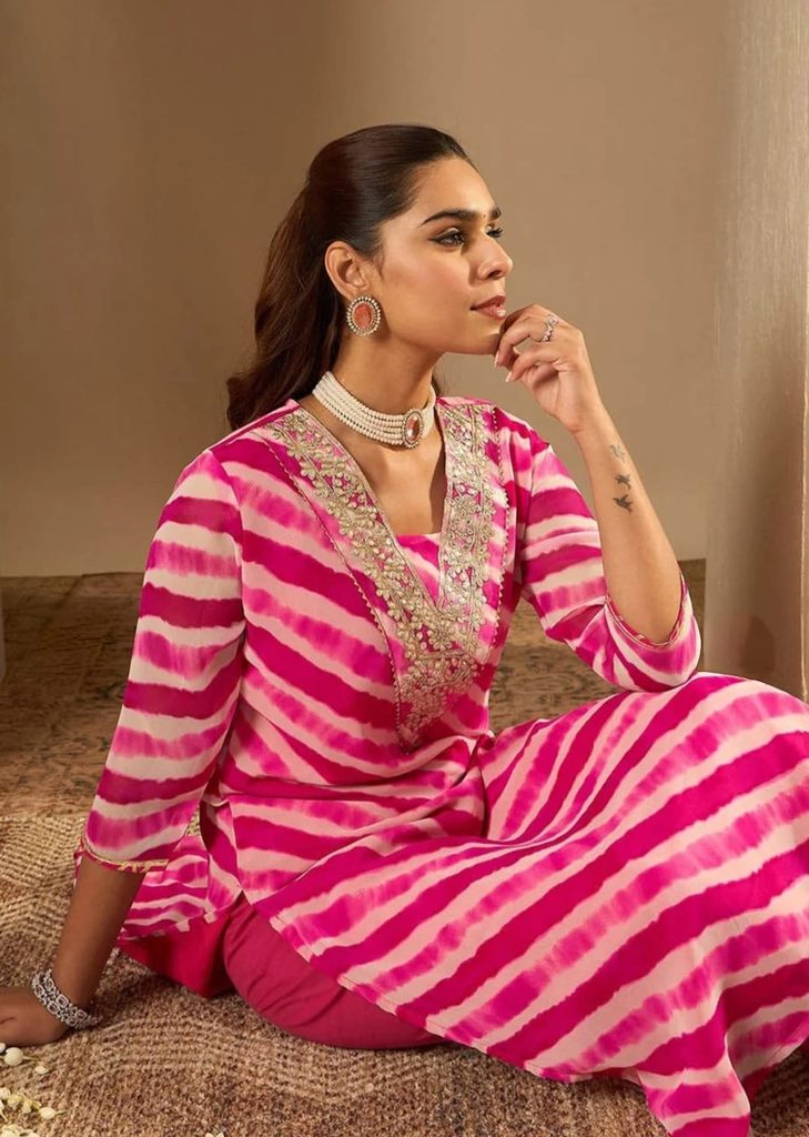 whatsapp image 2026 10 06 at 08.49.08Close-up of floral embroidery on the neckline of pink Leheriya kurta