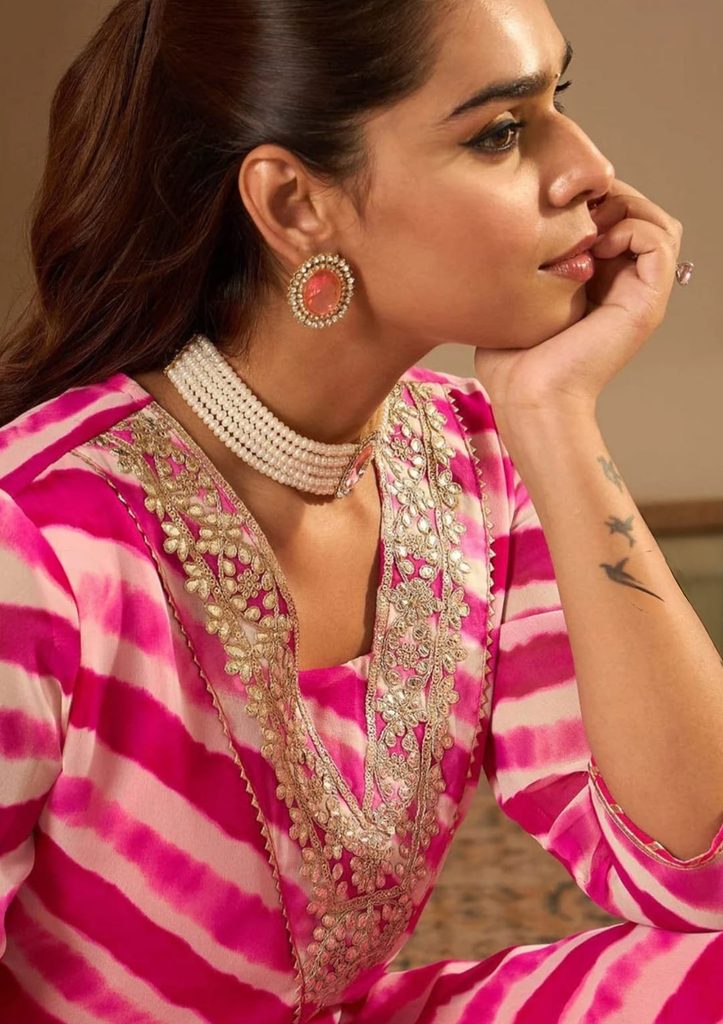 whatsapp image 2026 10 06 at 08.49.09 (2)Woman wearing a pink Leheriya embroidered kurta styled with pink trousers