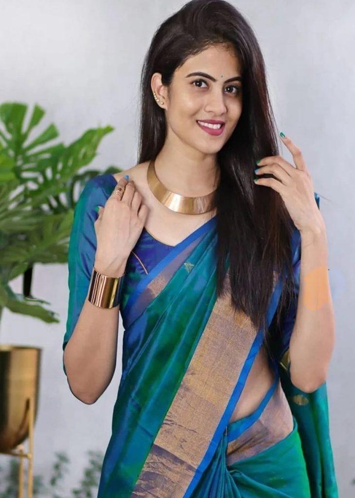 Model wearing All About You blue green saree with gold-tone jewellery