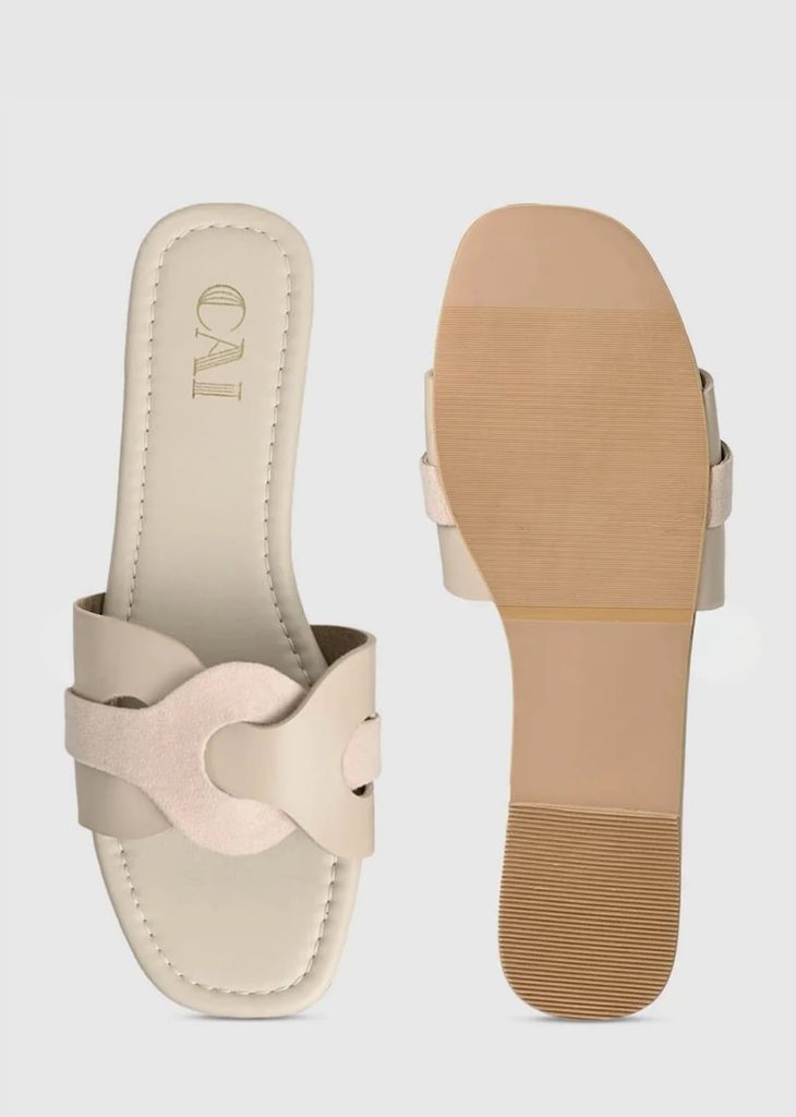 Close-up of contrasting textures on CAI beige sandal straps